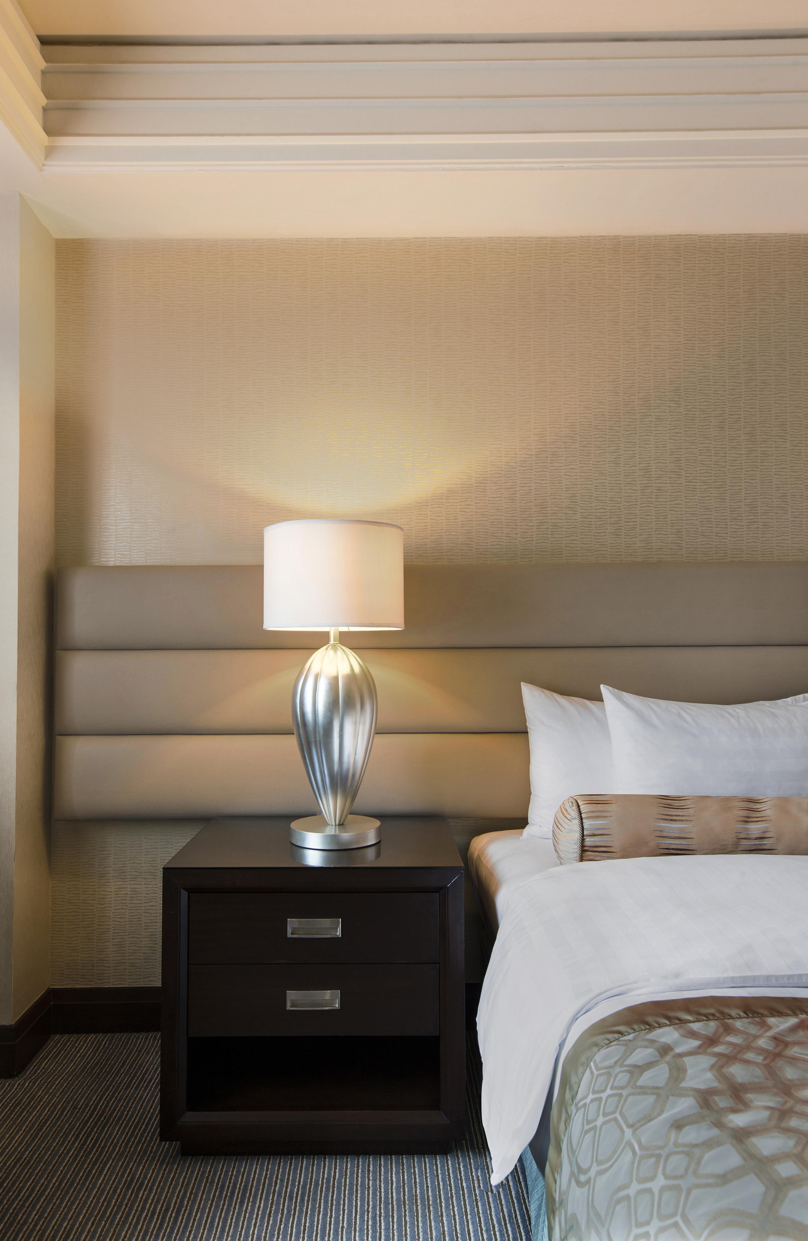 Crimson Hotel Filinvest City, Manila Muntinlupa City Exterior photo A lamp on a bedside table