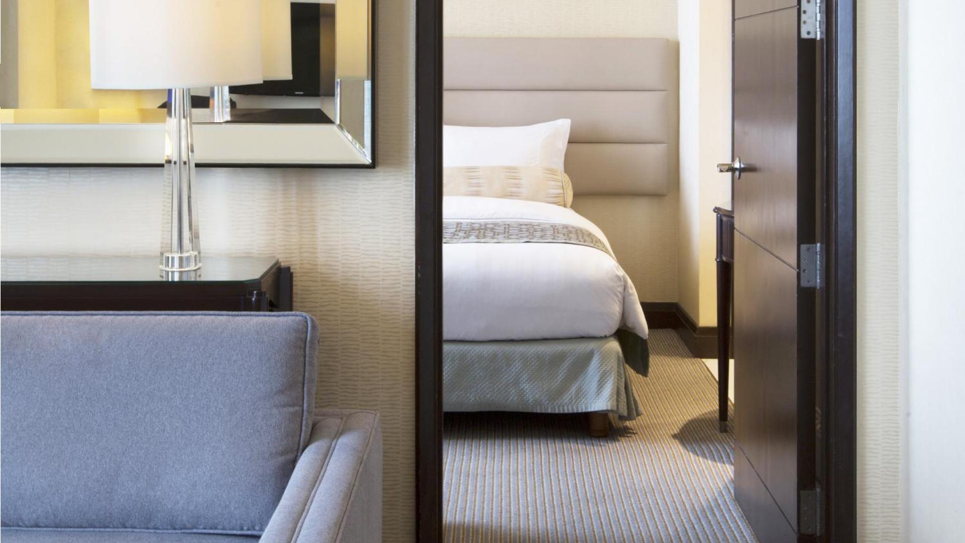 Crimson Hotel Filinvest City, Manila Muntinlupa City Exterior photo A bedroom in a suite at the Conrad Hong Kong